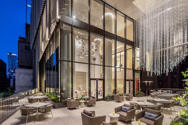 building lobby featuring a high ceiling and expansive windows