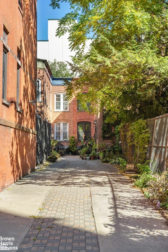 7 Sylvan Ct, New York City, NY 10035 - view of front facade with brick siding and concrete driveway