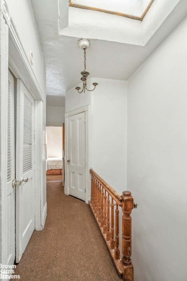 7 Sylvan Ct, New York City, NY 10035 - corridor with light colored carpet and an upstairs landing