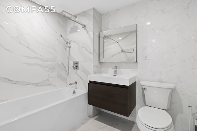 2218 Ocean Ave Unit 5B, New York City, NY 11229 - bathroom featuring tile walls, toilet, vanity, a ceiling fan, and tub / shower combination
