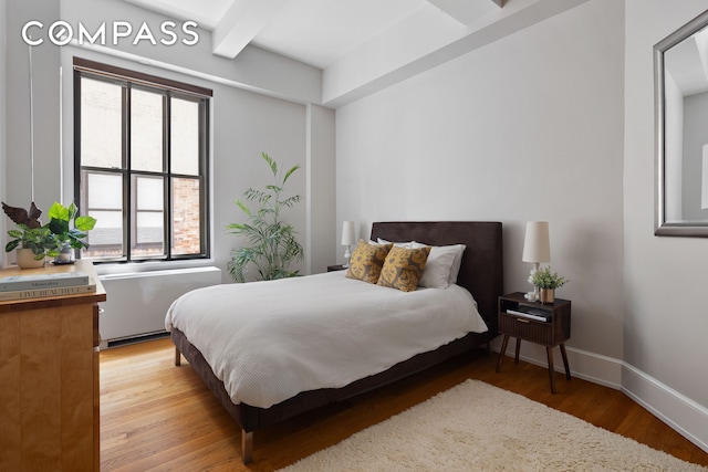 130 W 30th St Unit 3B, New York City, NY 10001 - bedroom featuring light wood-style floors and beamed ceiling