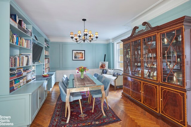 360 Riverside Dr Unit 8A, New York City, NY 10025 - dining area with a chandelier, ornamental molding, and a decorative wall