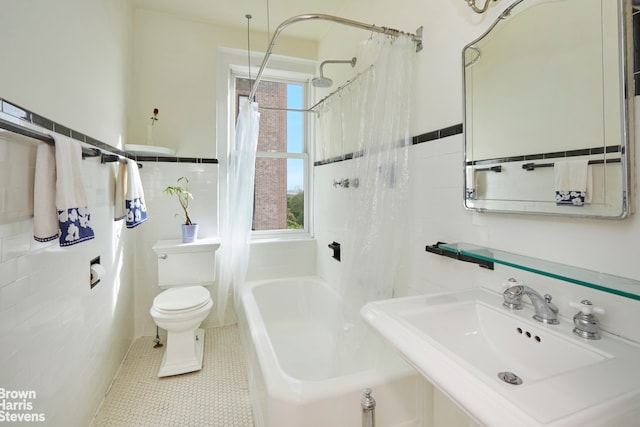 360 Riverside Dr Unit 8A, New York City, NY 10025 - full bathroom with tile walls, shower / tub combo with curtain, and wainscoting