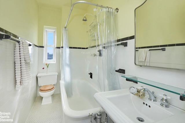 360 Riverside Dr Unit 8A, New York City, NY 10025 - bathroom with tile walls, wainscoting, shower / tub combo with curtain, and tile patterned flooring