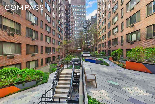 420 E 64th St Unit W4D, New York City, NY 10065 - view of home's community featuring a city view and stairway
