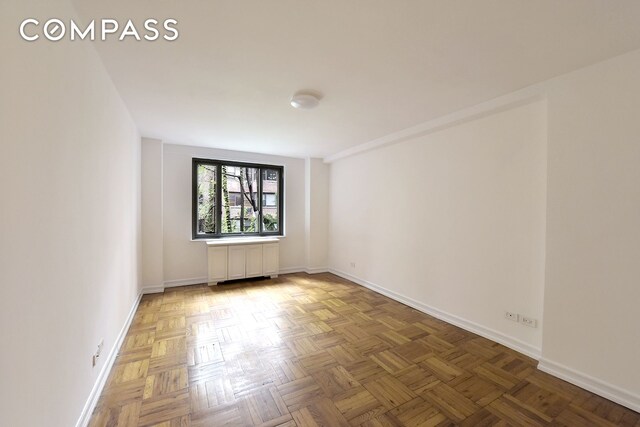 420 E 64th St Unit W4D, New York City, NY 10065 - unfurnished room with baseboards