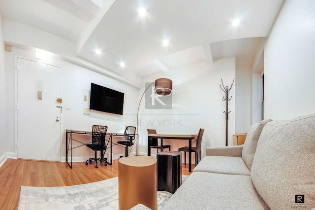 living area with wood finished floors, recessed lighting, baseboards, and beam ceiling