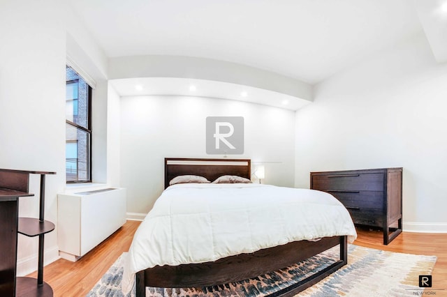 bedroom with light wood-style flooring, baseboards, and recessed lighting