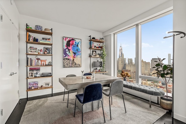 252 S St Unit 47K, New York City, NY 10002 - dining room featuring wood finished floors and baseboards