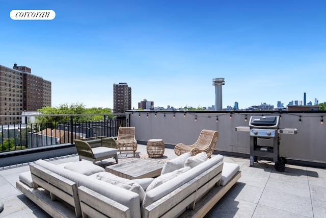 view of patio with a city view, an outdoor living space, a balcony, and a grill