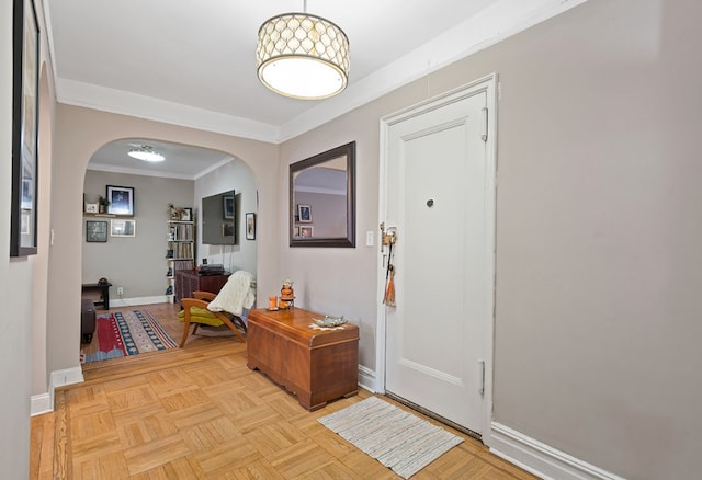 35-06 88th St Unit 5-D, New York City, NY 11414 - entrance foyer featuring crown molding, arched walkways, and baseboards