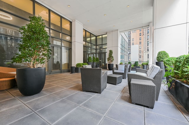 community lobby featuring a wall of windows