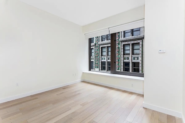 75 Wall St Unit 18Fg, New York City, NY 10005 - empty room with wood finished floors and baseboards