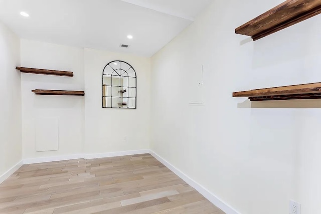 75 Wall St Unit 18Fg, New York City, NY 10005 - unfurnished room featuring light wood-type flooring, baseboards, and recessed lighting