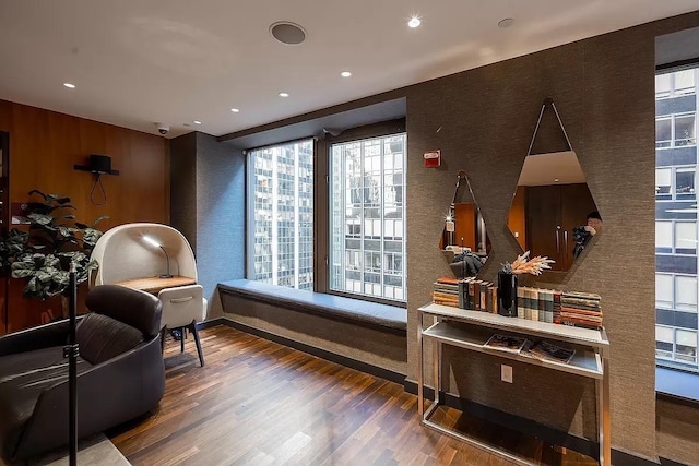 75 Wall St Unit 18Fg, New York City, NY 10005 - living area with a textured wall, wood finished floors, recessed lighting, and baseboards