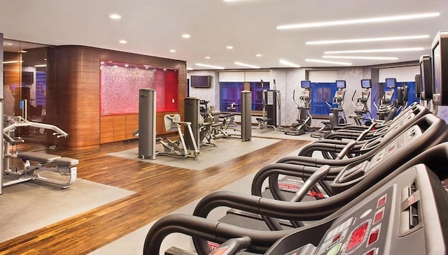 75 Wall St Unit 18Fg, New York City, NY 10005 - workout area featuring recessed lighting and wood finished floors