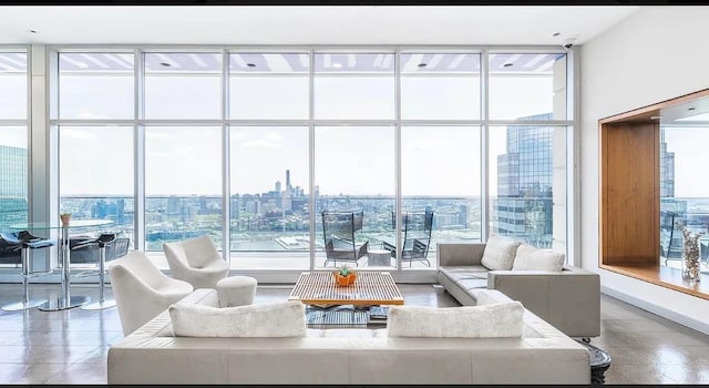 75 Wall St Unit 18Fg, New York City, NY 10005 - living area featuring expansive windows, healthy amount of natural light, and a city view