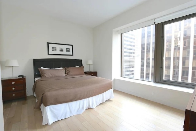 75 Wall St Unit 18Fg, New York City, NY 10005 - bedroom featuring light wood-style flooring
