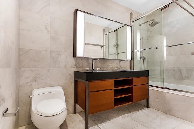 75 Wall St Unit 18Fg, New York City, NY 10005 - full bathroom featuring toilet, vanity, and tile walls
