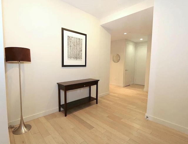 75 Wall St Unit 18Fg, New York City, NY 10005 - hallway with light wood-type flooring, baseboards, and recessed lighting