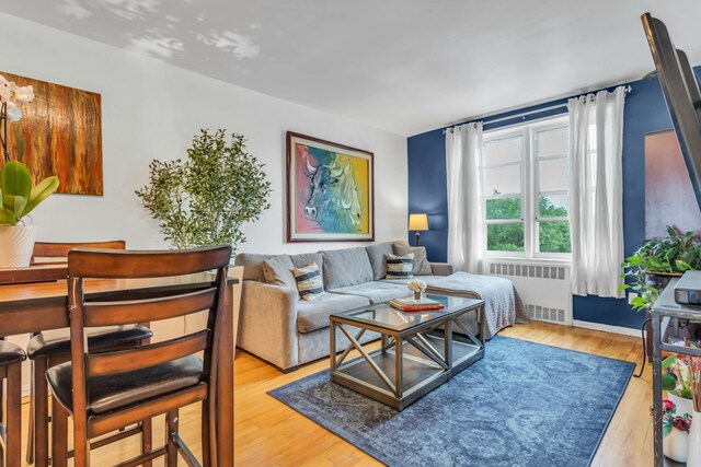 88-01 35th Ave Unit 5F, New York City, NY 11372 - living area featuring radiator and wood finished floors