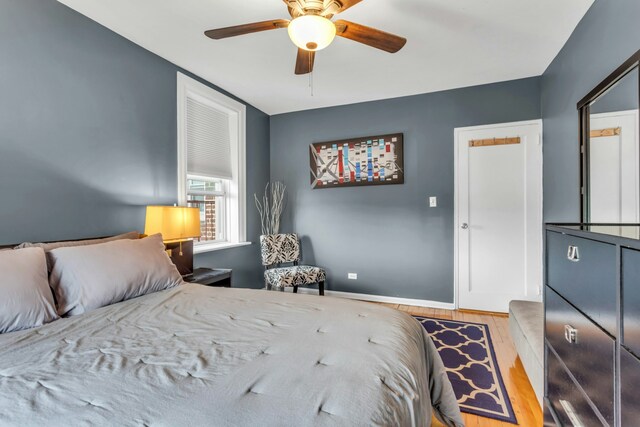 88-01 35th Ave Unit 5F, New York City, NY 11372 - bedroom featuring wood finished floors, baseboards, and ceiling fan