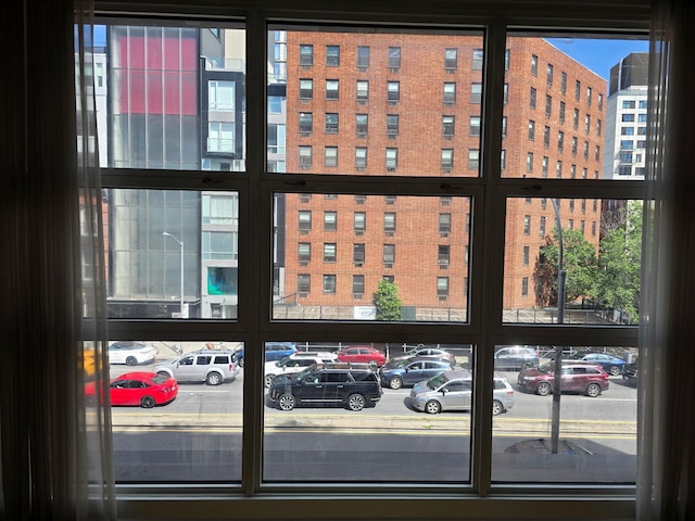 view of building exterior with uncovered parking