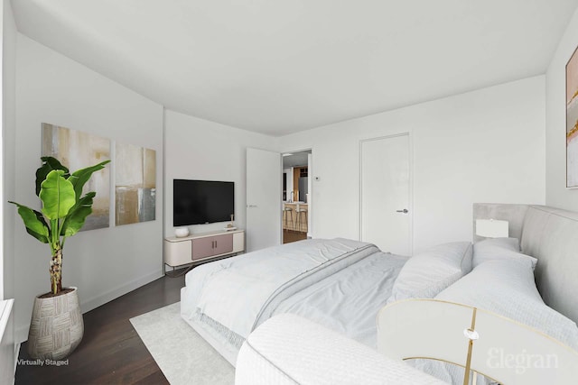 bedroom featuring dark wood-style floors