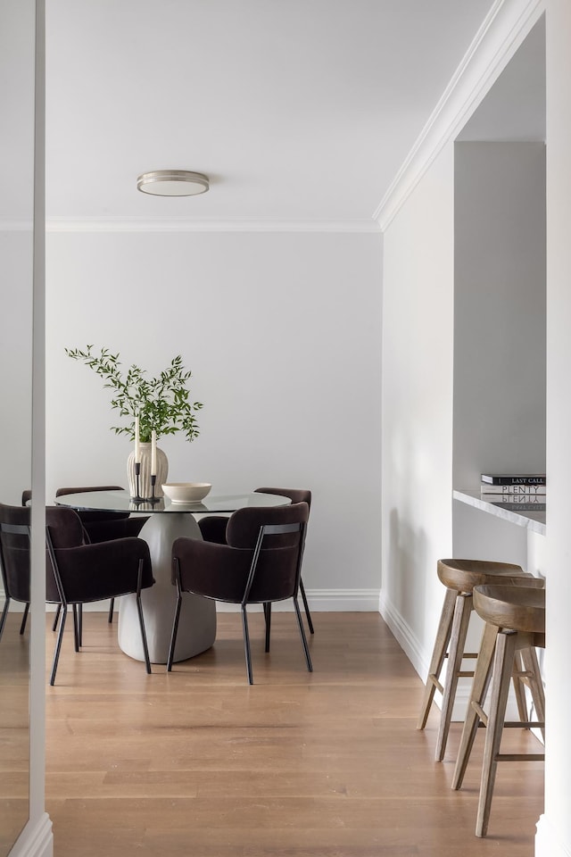 625 Main St Unit 135, New York City, NY 10044 - dining room with crown molding, wood finished floors, and baseboards