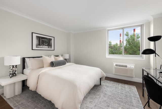 625 Main St Unit 834, New York City, NY 10044 - bedroom featuring an AC wall unit, dark wood-style floors, baseboards, and crown molding