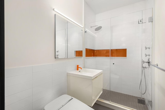 60 Broadway Unit 7K, New York City, NY 11249 - full bath with a shower stall, toilet, tile walls, and vanity