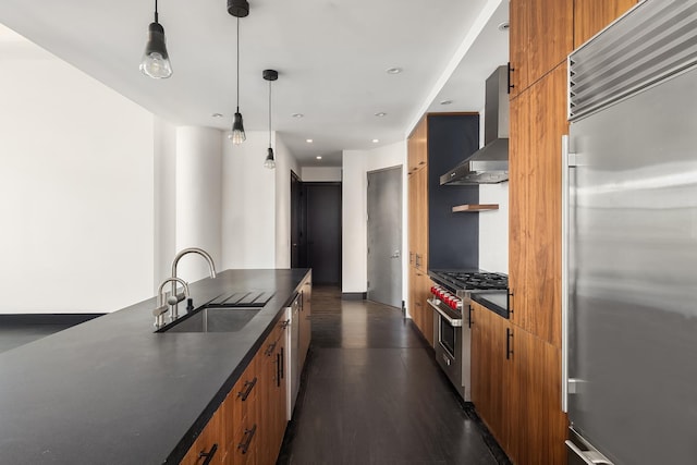60 Broadway Unit 7K, New York City, NY 11249 - kitchen with high quality appliances, a sink, dark countertops, wall chimney range hood, and brown cabinets
