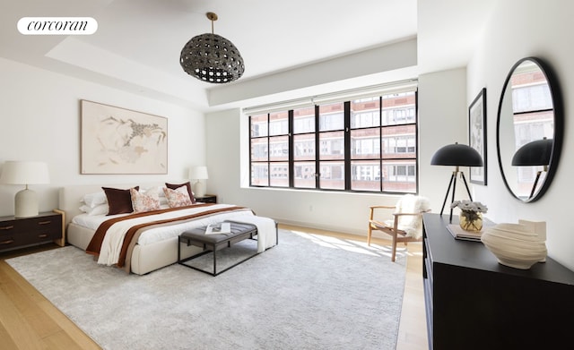 550 W 29th St Unit 9Afl, New York City, NY 10001 - bedroom featuring wood finished floors and a raised ceiling