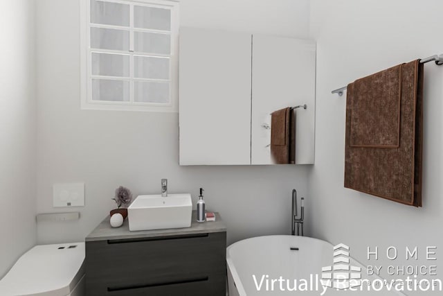 415 E 80th St Unit 3E, New York City, NY 10075 - bathroom featuring vanity, a soaking tub, and toilet