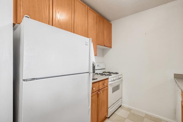 4-74 48th Ave Unit 38-H, New York City, NY 11109 - kitchen with white appliances, light floors, and light countertops