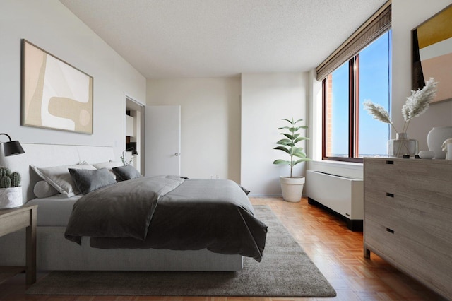 4-74 48th Ave Unit 38-H, New York City, NY 11109 - bedroom with a textured ceiling