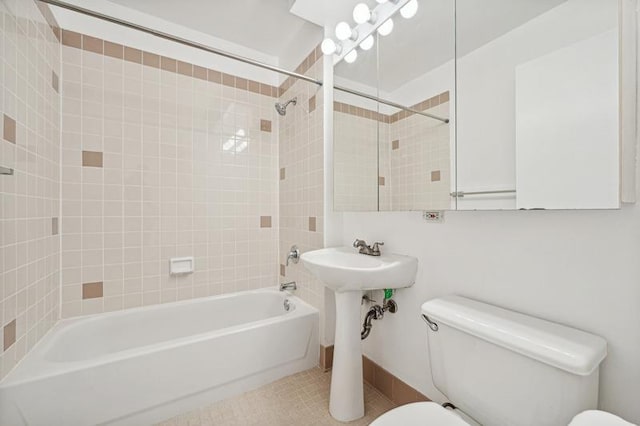 4-74 48th Ave Unit 38-H, New York City, NY 11109 - bathroom with shower / washtub combination and tile patterned floors