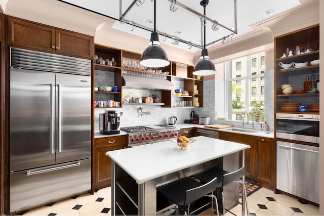 390 W End Ave Unit 2H, New York City, NY 10024 - kitchen featuring open shelves, high quality appliances, light floors, and a sink