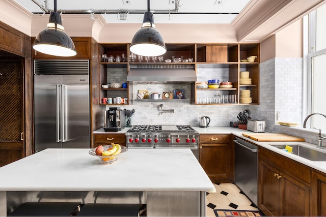 390 W End Ave Unit 2H, New York City, NY 10024 - kitchen with high end appliances, open shelves, a sink, light countertops, and decorative backsplash