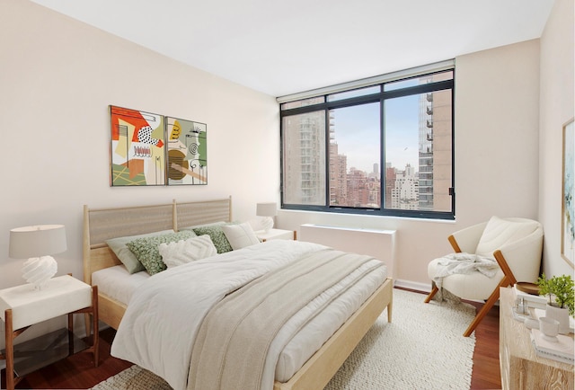 343 E 74th St Unit Ph2A, New York City, NY 10021 - bedroom featuring wood finished floors and a view of city