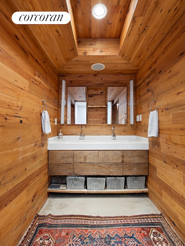 full bathroom featuring wood ceiling, wood walls, and double vanity