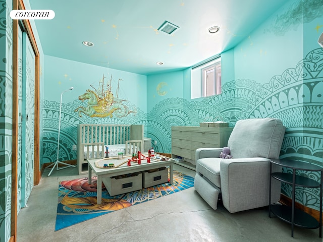 bedroom featuring concrete floors and recessed lighting