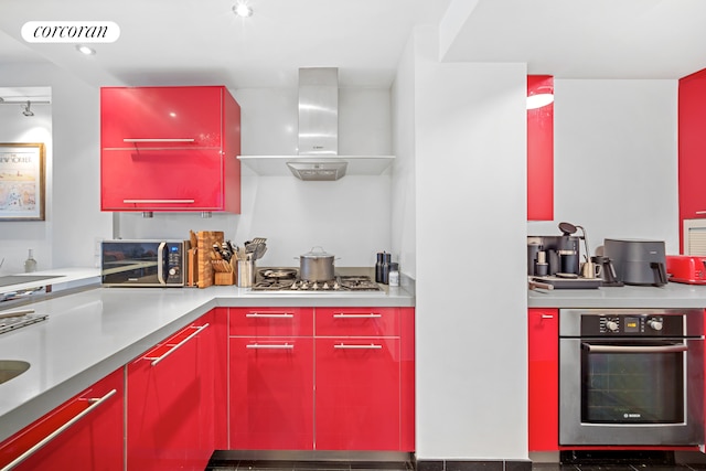 250 E 40th St Unit 17F, New York City, NY 10016 - kitchen with red cabinetry, oven, range hood, and gas stovetop