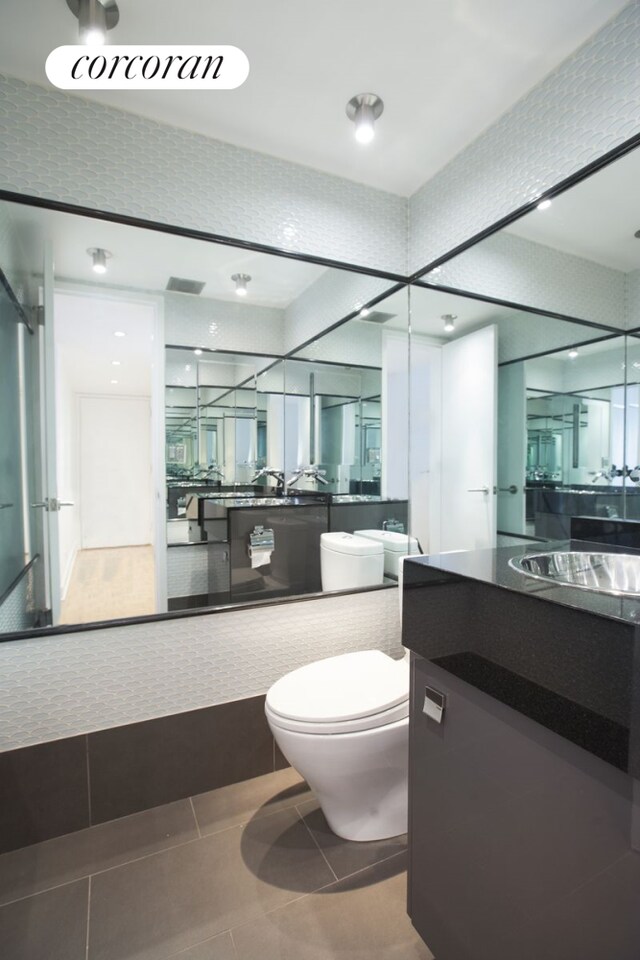 250 E 40th St Unit 17F, New York City, NY 10016 - bathroom with vanity and tile patterned flooring