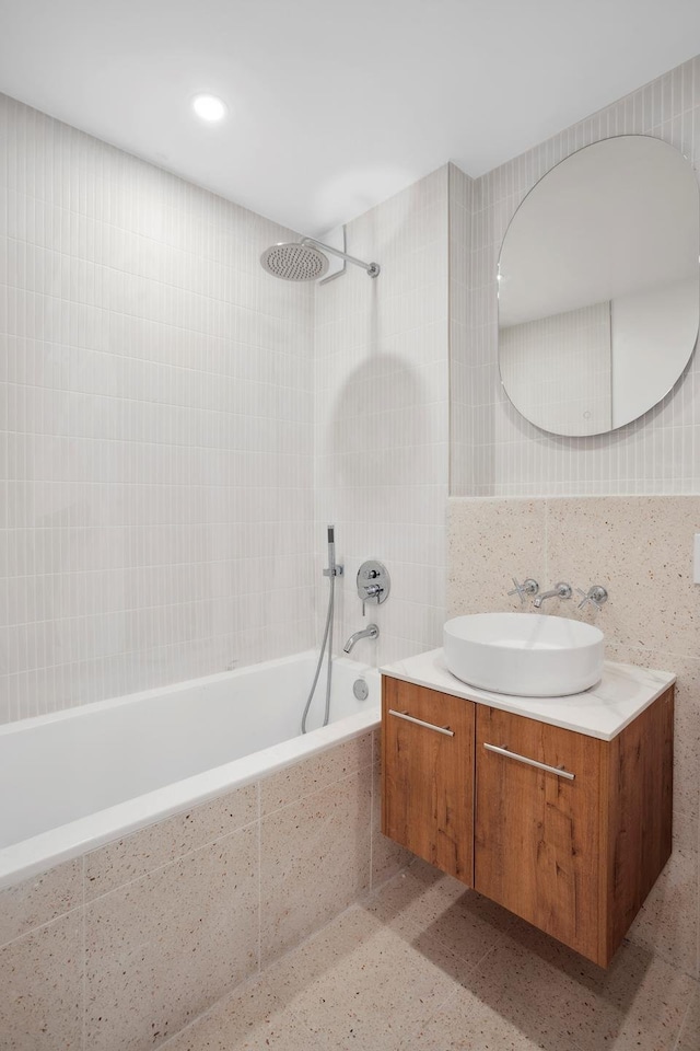 1330 5th Ave Unit 4M, New York City, NY 10026 - full bath featuring tiled shower / bath, vanity, backsplash, and tile walls