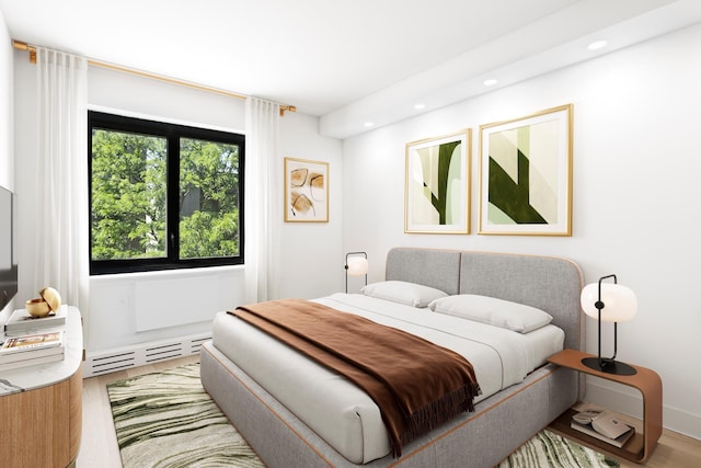 1330 5th Ave Unit 4M, New York City, NY 10026 - bedroom with a baseboard heating unit, recessed lighting, and wood finished floors