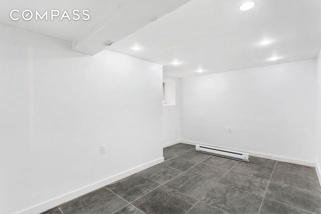 finished basement featuring a baseboard heating unit, recessed lighting, and baseboards