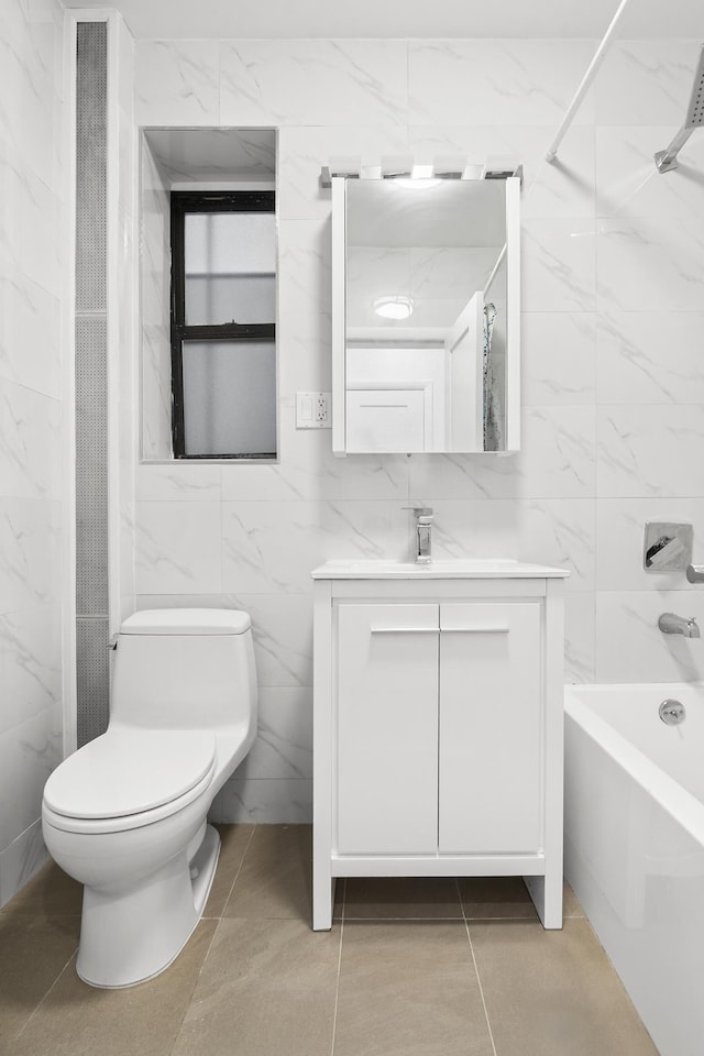 bathroom featuring tile walls, toilet, shower / bath combination, vanity, and tile patterned floors