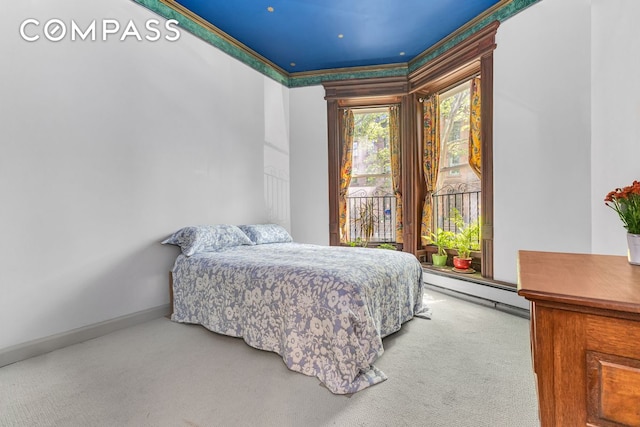carpeted bedroom with a baseboard heating unit, access to outside, baseboards, and ornamental molding