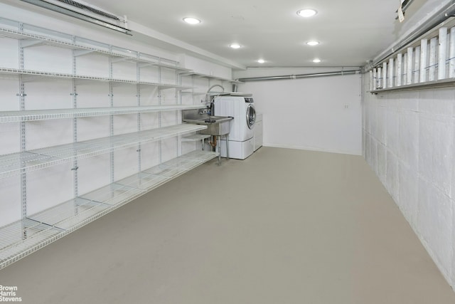 26-08 24th Ave, New York City, NY 11102 - below grade area featuring separate washer and dryer and recessed lighting